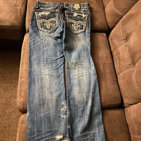 Selling a pair of blue denim rock revival jeans size 34 and boot cut.